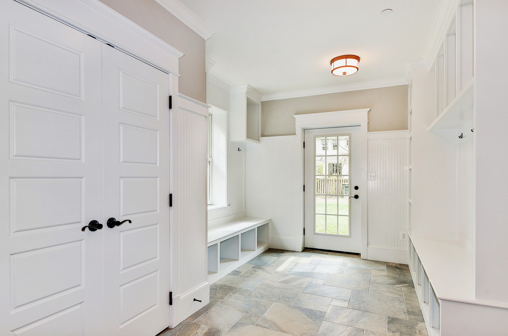 Example of a mid-sized transitional gender-neutral slate floor and multicolored floor mudroom design in DC Metro with beige walls