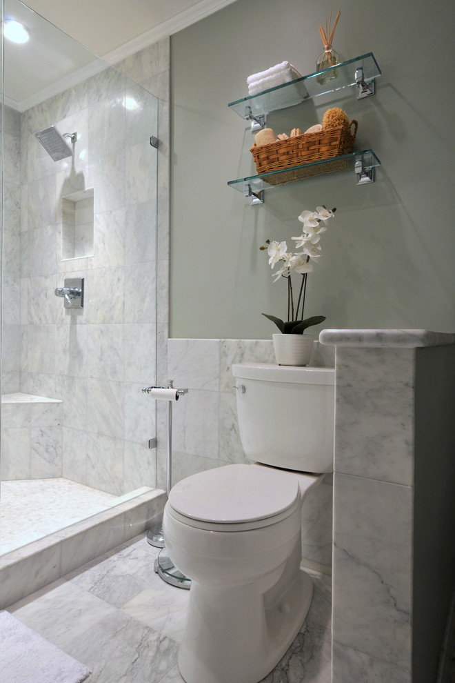 Contemporary bathroom in Atlanta with a two-piece toilet, white tile and marble.