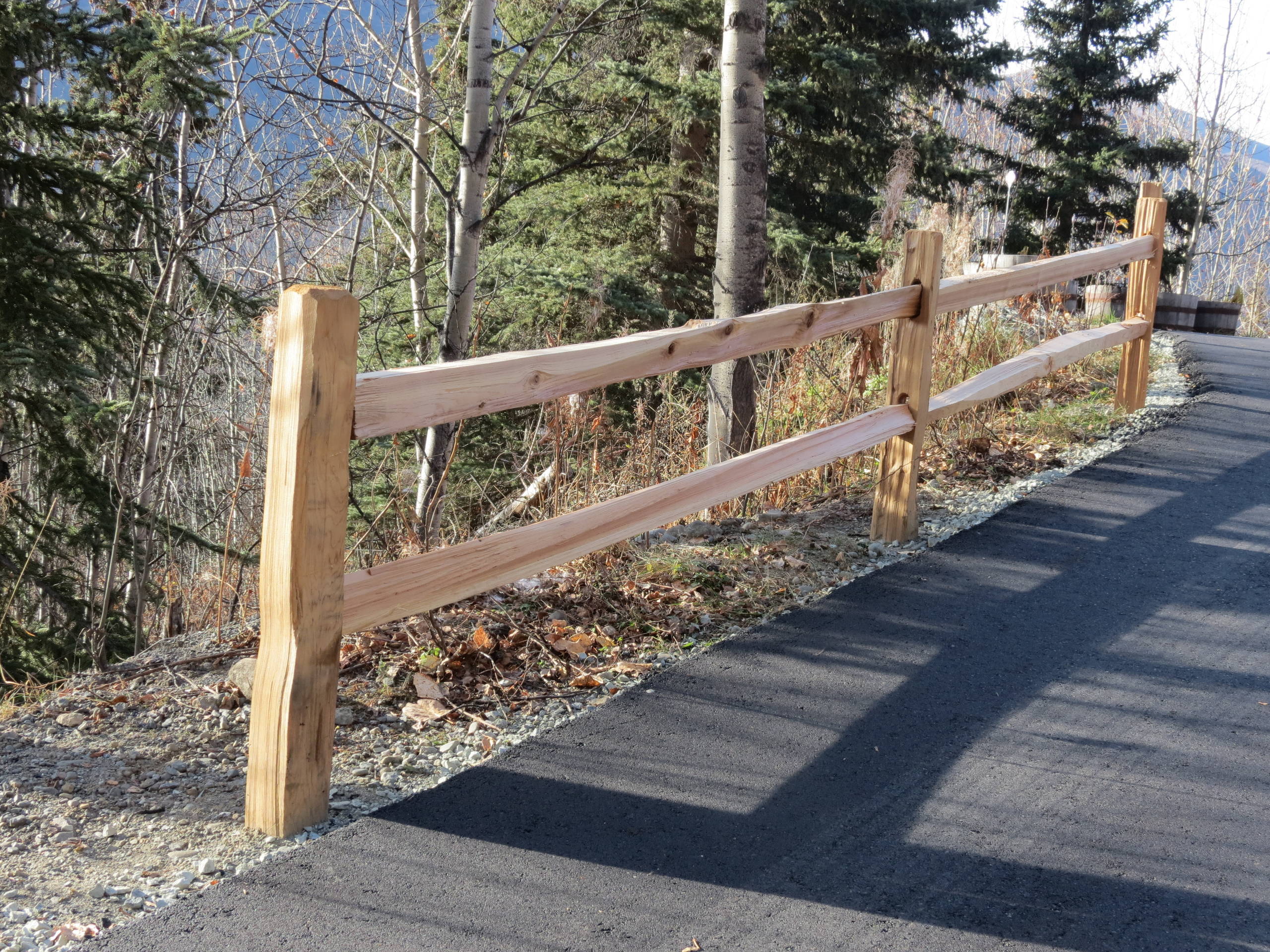 Cedar rail fence along driveway entrance