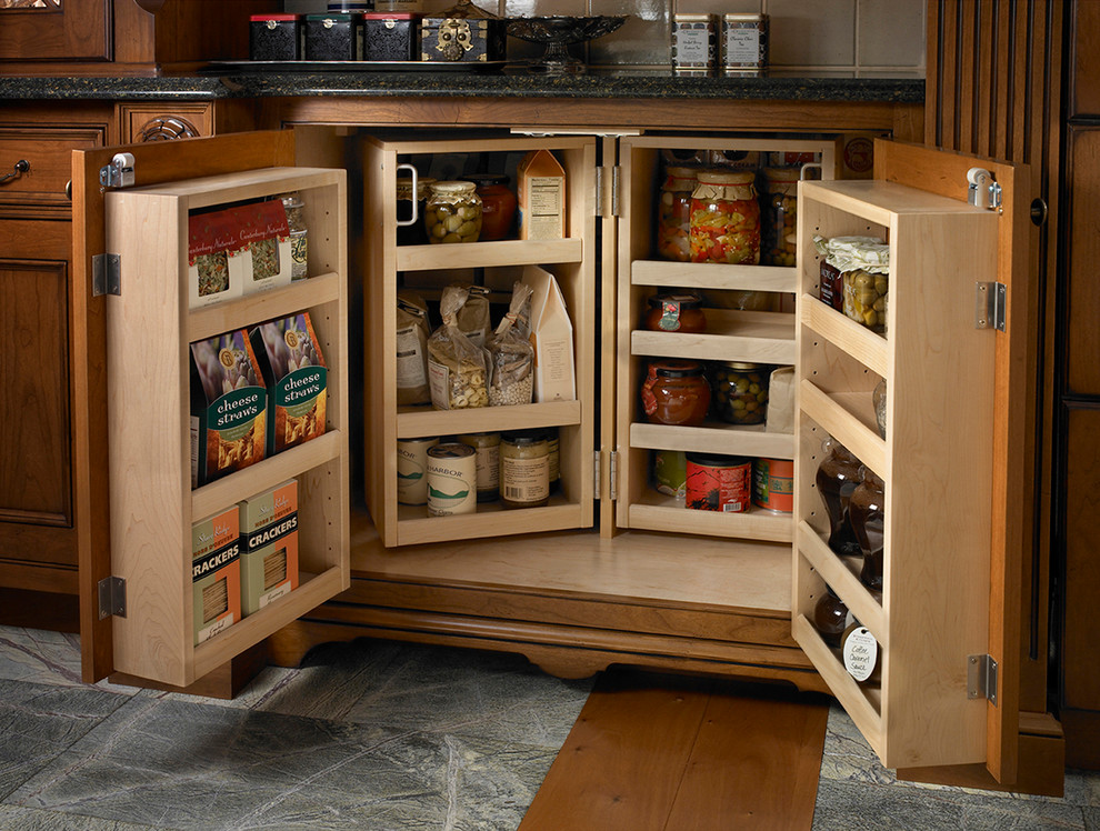 Traditional kitchen pantry in Other with beaded inset cabinets and medium wood cabinets.