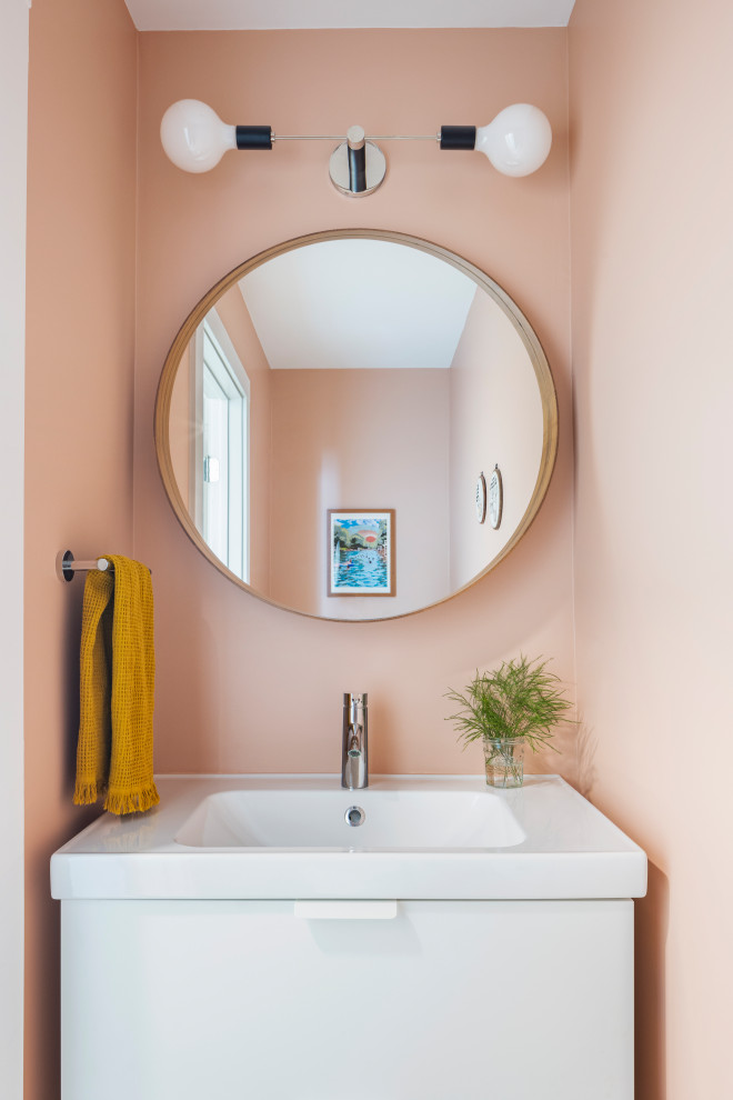 Small scandinavian powder room in Austin with flat-panel cabinets, white cabinets, pink walls, white benchtops and a floating vanity.