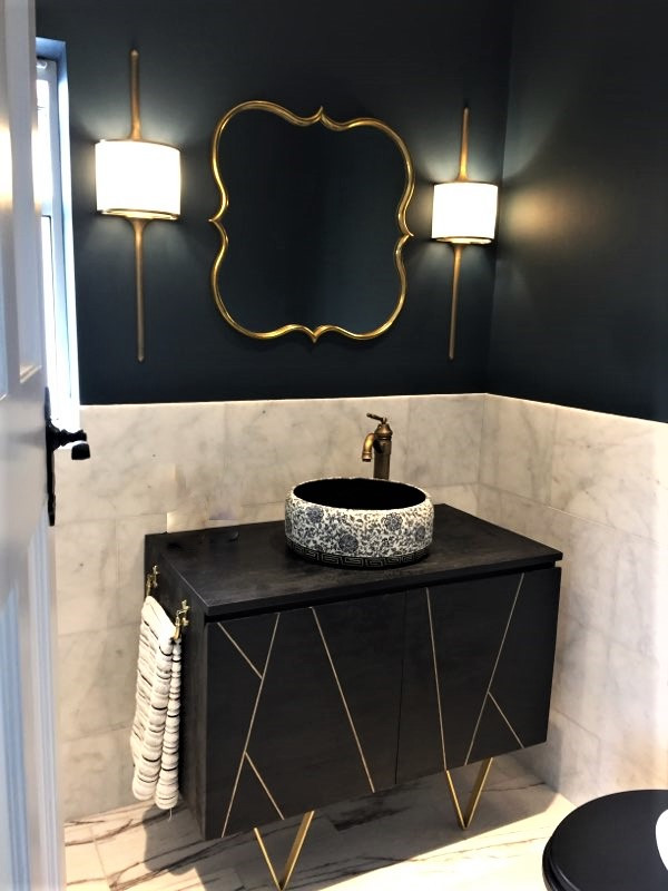 This is an example of a small eclectic master bathroom in London with dark wood cabinets, an open shower, white tile, marble, blue walls, marble floors, white floor, an open shower, a single vanity and a freestanding vanity.