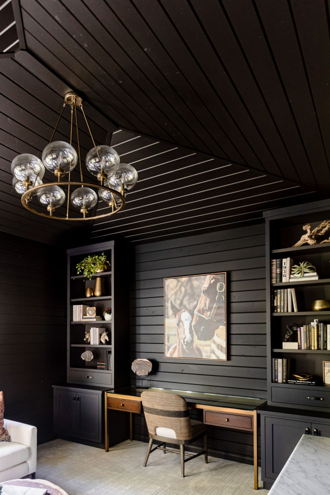 Example of a small mountain style built-in desk carpeted, multicolored floor, wood ceiling and wood wall study room design in Minneapolis with black walls