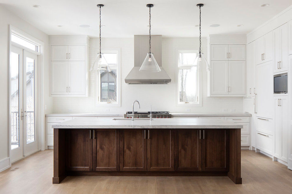 Example of a transitional kitchen design in Calgary