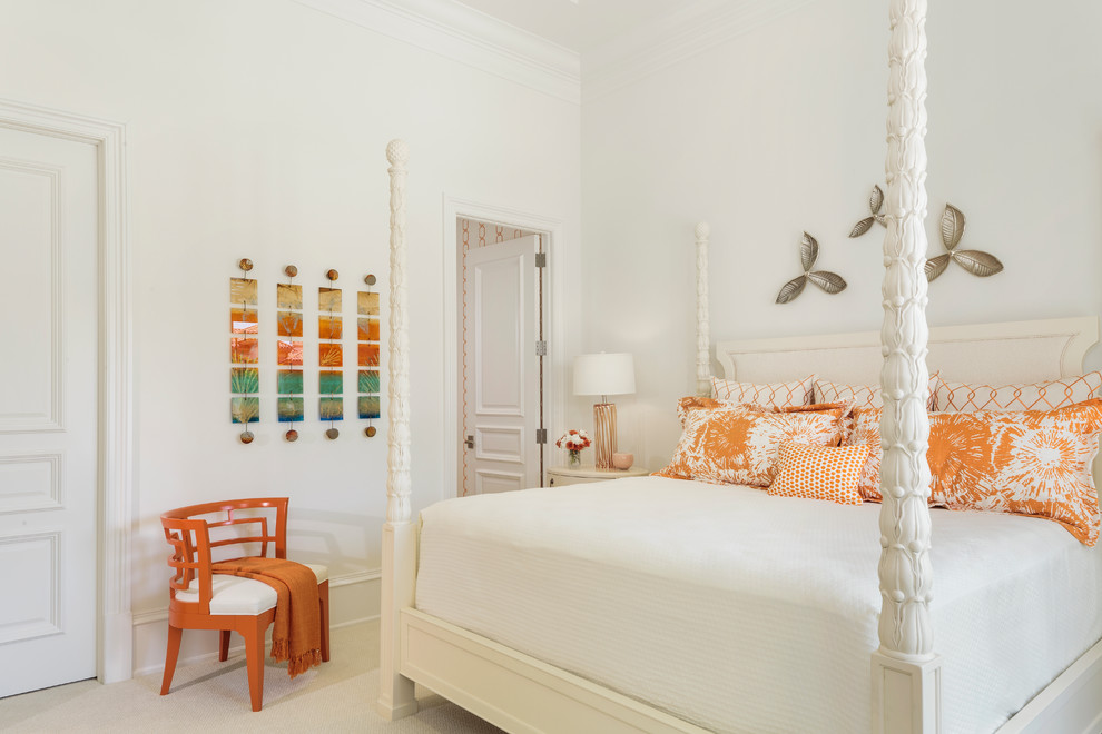 Photo of a mid-sized beach style bedroom in Miami with white walls, carpet, no fireplace and beige floor.
