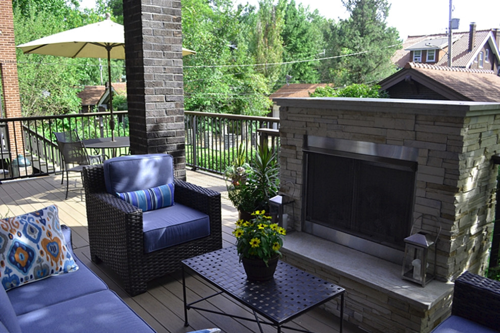 Mid-sized transitional backyard deck photo in St Louis with a fireplace and a roof extension