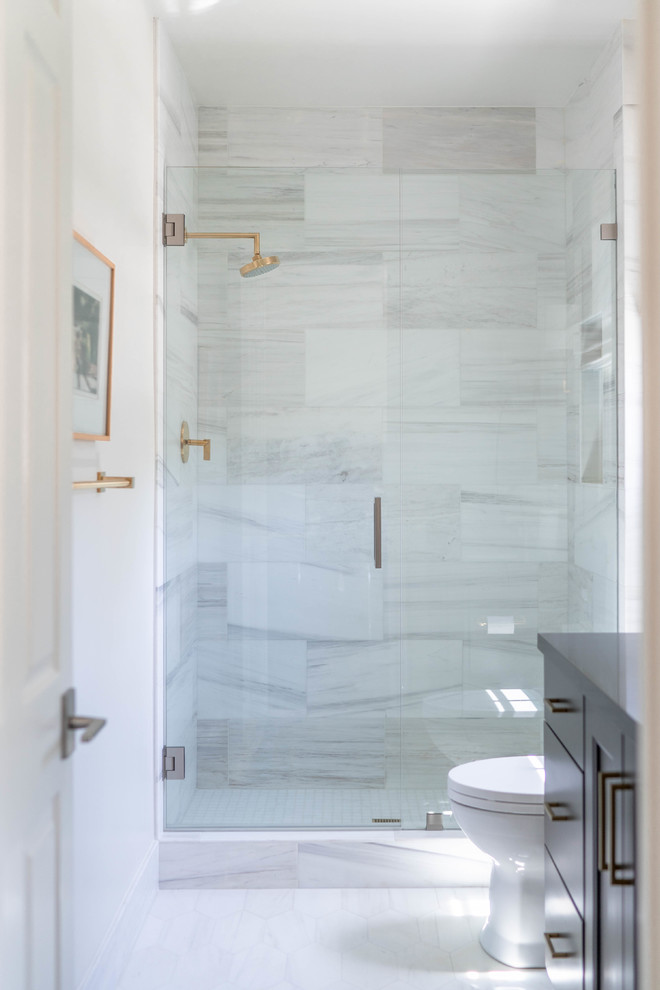 Design ideas for a small contemporary 3/4 bathroom in San Diego with shaker cabinets, grey cabinets, an alcove shower, a one-piece toilet, beige tile, porcelain tile, white walls, marble floors, solid surface benchtops, white floor, a hinged shower door and grey benchtops.