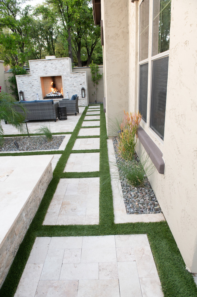 Fireplace , Travertine pavers, artificial turf