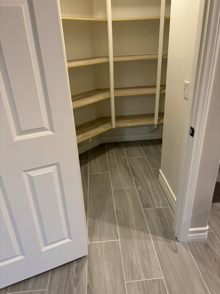 Tile plank install / laundry room cabinetry