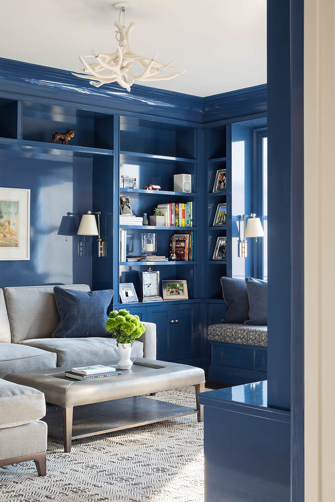 Design ideas for a transitional family room in New York with blue walls and beige floor.