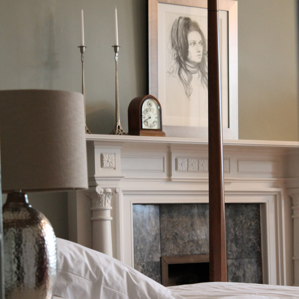 Inspiration for a medium sized traditional guest bedroom in Other with green walls, medium hardwood flooring, a standard fireplace and a tiled fireplace surround.