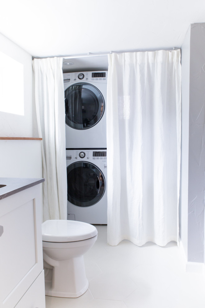 Example of a transitional laundry room design in Denver