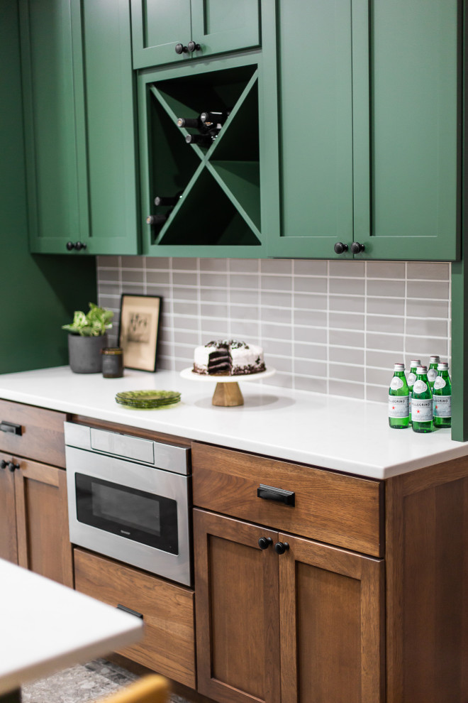 Design ideas for a mid-sized transitional l-shaped eat-in kitchen in Philadelphia with an undermount sink, shaker cabinets, green cabinets, quartz benchtops, brown splashback, porcelain splashback, black appliances, porcelain floors, a peninsula, multi-coloured floor and white benchtop.