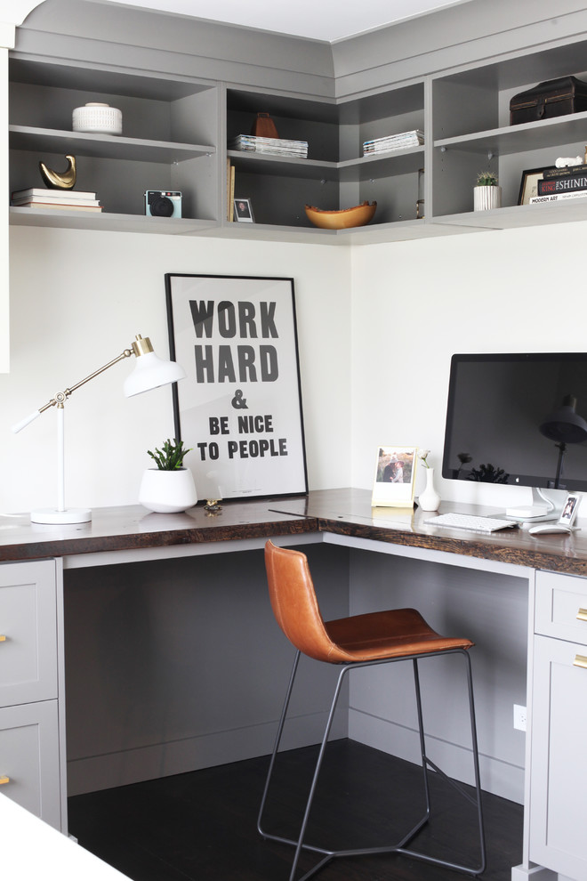 Small transitional built-in desk dark wood floor and brown floor home office photo in Chicago with gray cabinets, wood countertops and a side-by-side washer/dryer