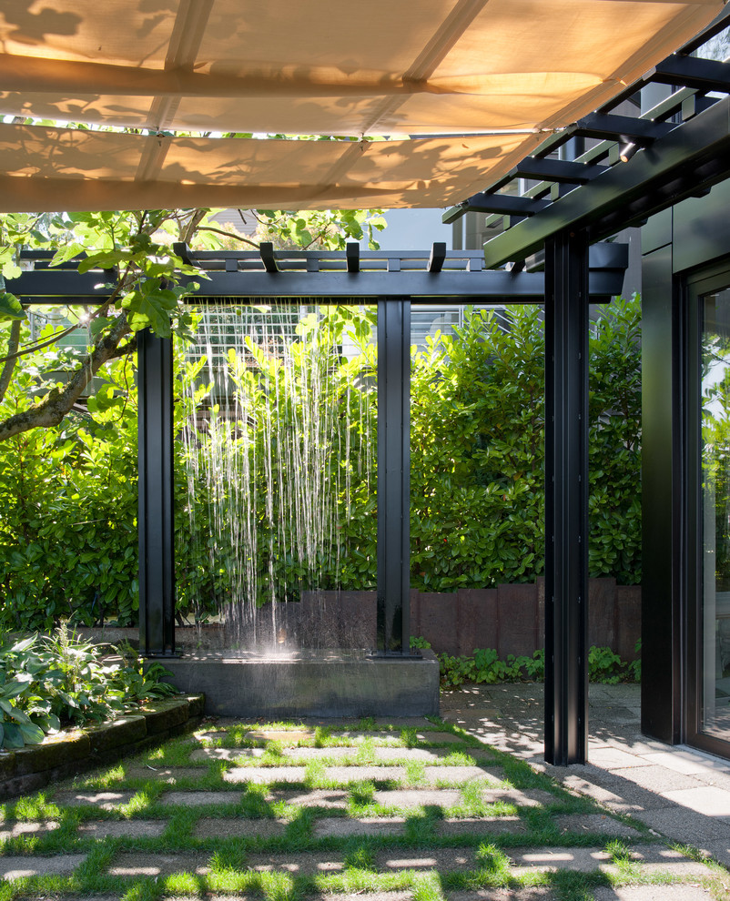 Design ideas for a contemporary garden in Seattle with a water feature.