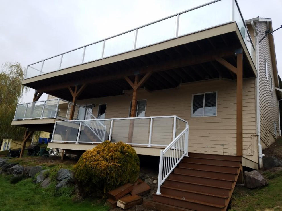 Deck - large modern backyard deck idea in Seattle with no cover