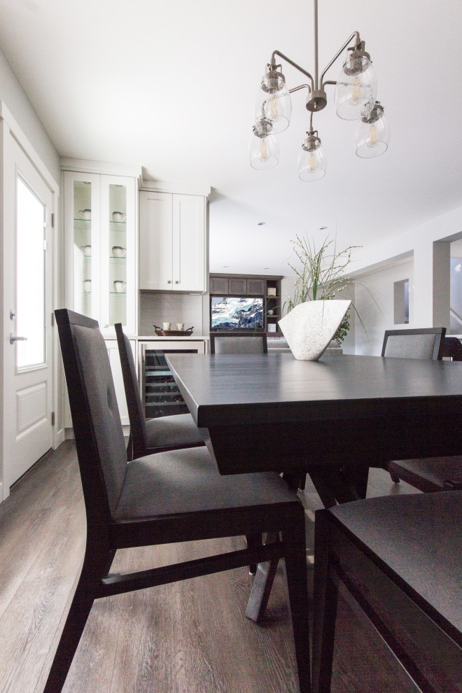 Example of a transitional home design design in Calgary