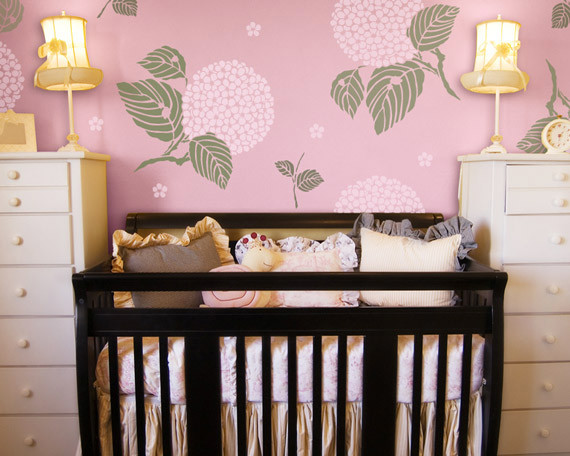 This is an example of an asian nursery for girls in San Diego with pink walls.