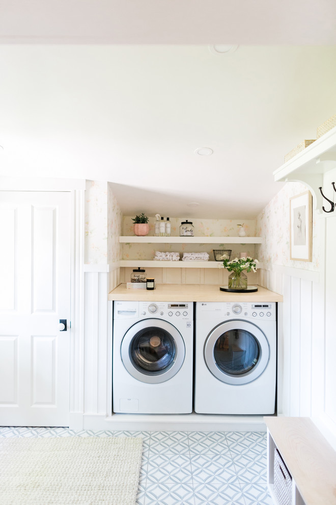 Photo of a traditional laundry room in Boston with marble floors.