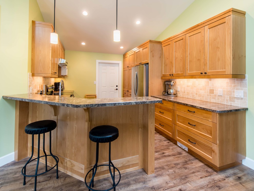 Small arts and crafts galley kitchen photo in Vancouver with a drop-in sink, shaker cabinets, light wood cabinets, laminate countertops, multicolored backsplash, ceramic backsplash and stainless steel appliances