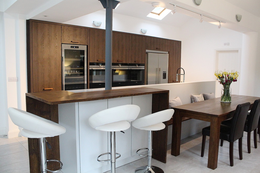 A kitchen with a table and chairs