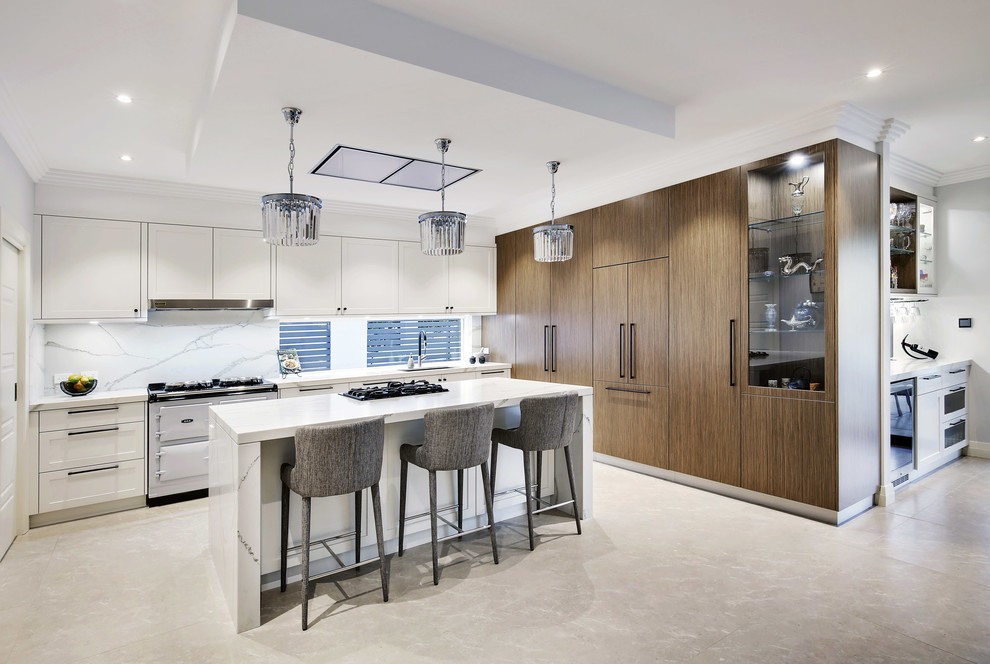 Design ideas for a large modern l-shaped eat-in kitchen in Sydney with a double-bowl sink, shaker cabinets, white cabinets, quartz benchtops, white splashback, stone tile splashback, coloured appliances, limestone floors, with island and beige floor.