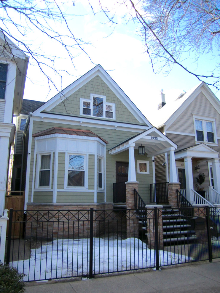 Photo of a mid-sized traditional two-storey beige exterior in Chicago with concrete fiberboard siding.