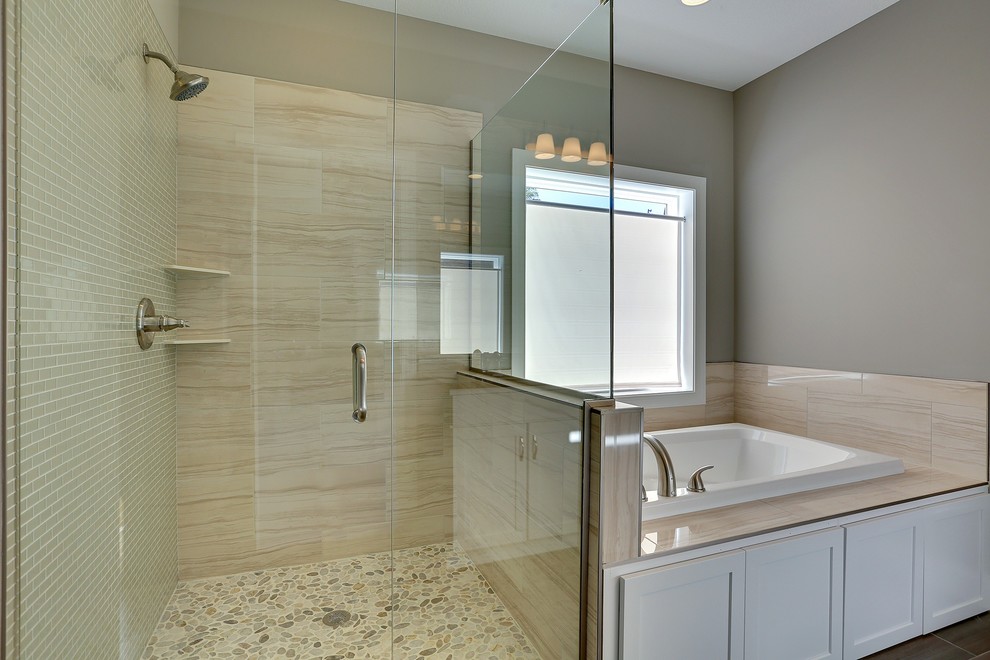 Mid-sized contemporary master bathroom in Minneapolis with a drop-in tub, a corner shower, grey walls and porcelain floors.
