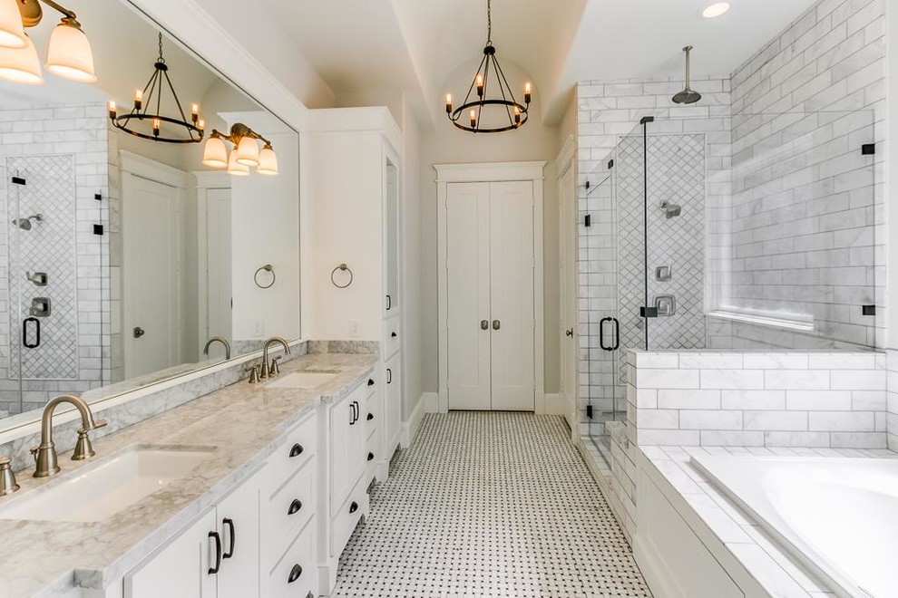 Mid-sized traditional master bathroom in Houston with flat-panel cabinets, white cabinets, a hot tub, a shower/bathtub combo, a two-piece toilet, white walls, marble floors, an undermount sink, marble benchtops, white floor, marble and a hinged shower door.