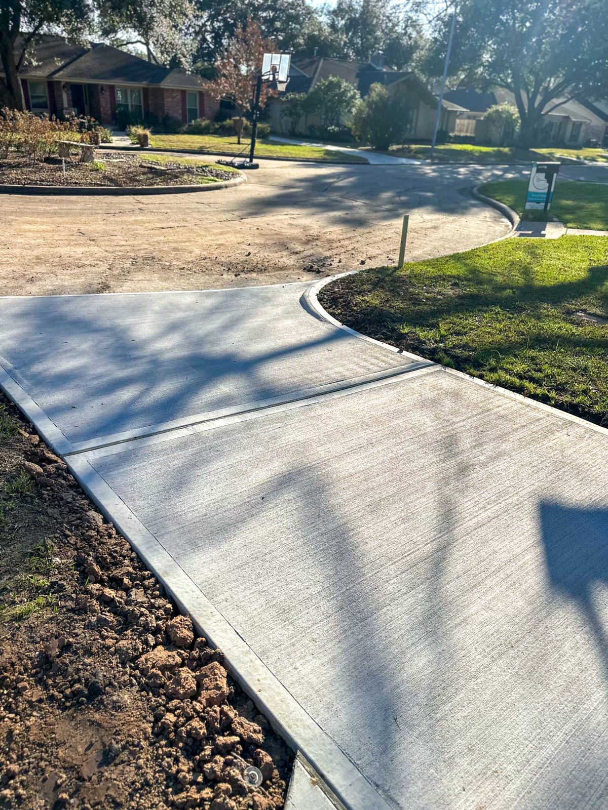 New driveway with sidewalks and stamped concrete!