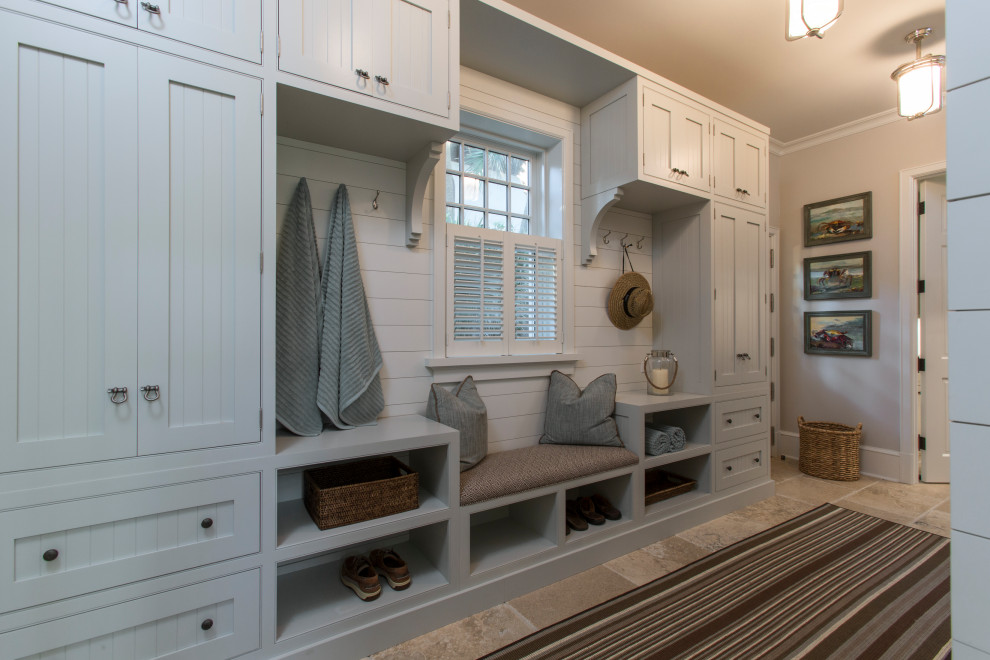 Design ideas for a traditional mudroom in Jacksonville with limestone floors.
