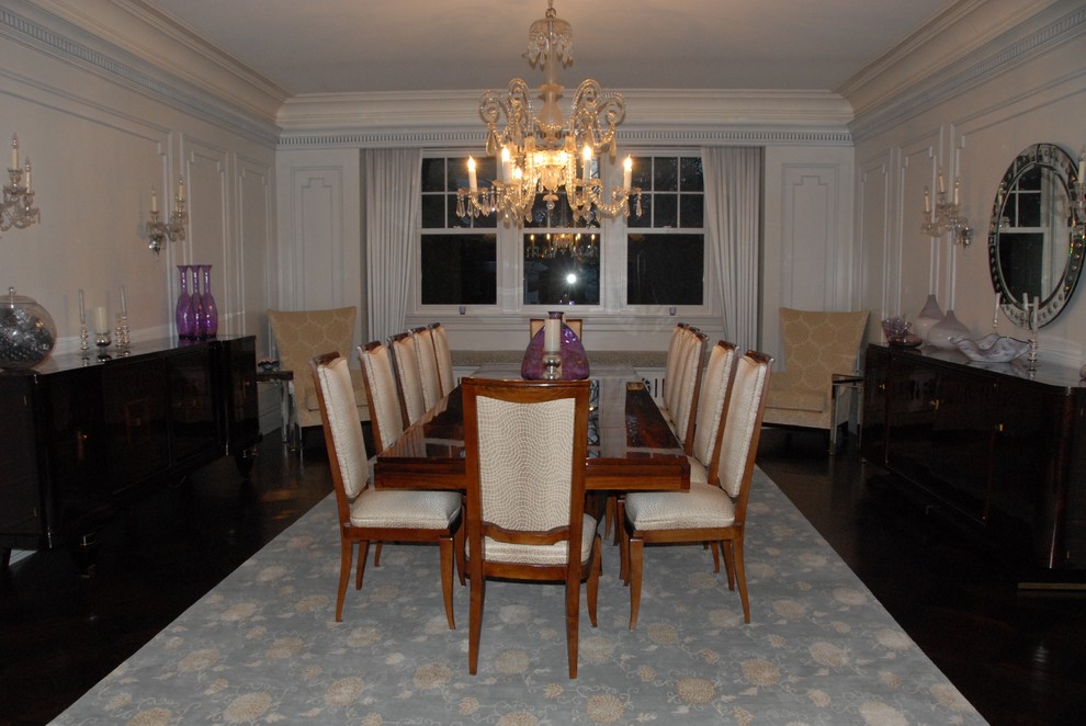 Large traditional separate dining room in New York with white walls, dark hardwood floors, no fireplace and brown floor.