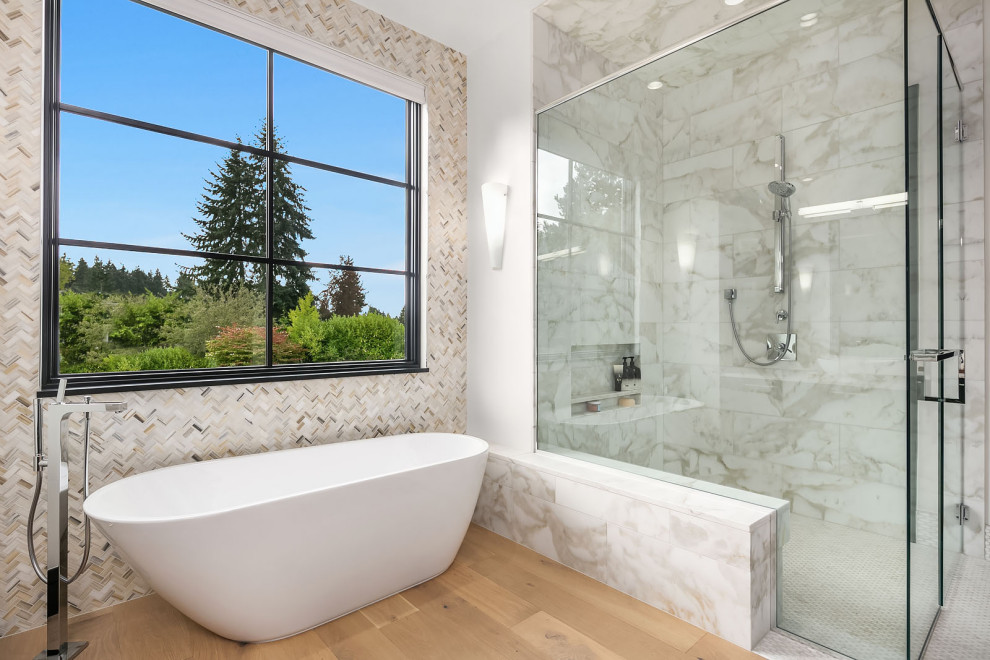 Contemporary master bathroom in Denver with a freestanding tub, a corner shower, beige tile, matchstick tile, light hardwood floors, beige floor, a hinged shower door, a niche and a shower seat.