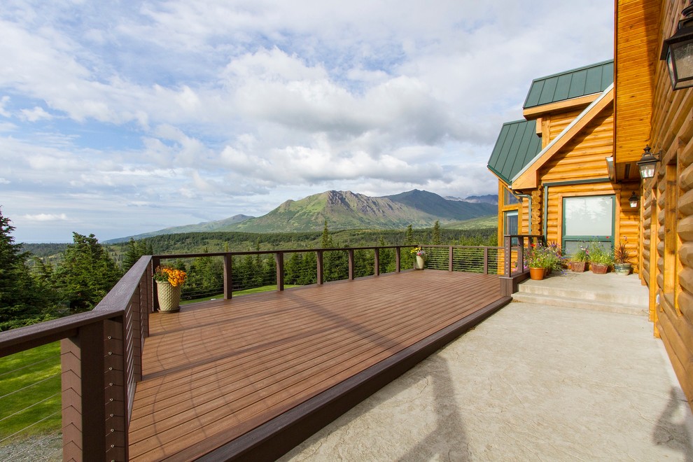 Mid-sized mountain style backyard deck photo with no cover