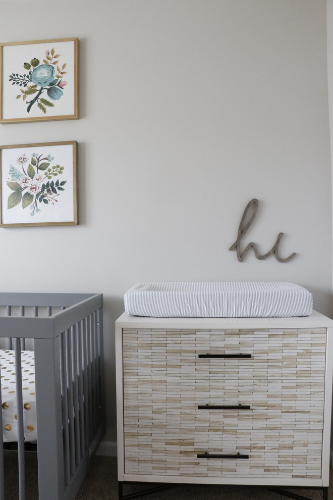 Inspiration for a small modern nursery for girls in St Louis with grey walls, carpet and grey floor.
