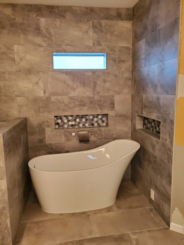 Inspiration for a medium sized rustic ensuite bathroom in Dallas with a freestanding bath, a corner shower, brown tiles, ceramic tiles, ceramic flooring, a hinged door and a wall niche.