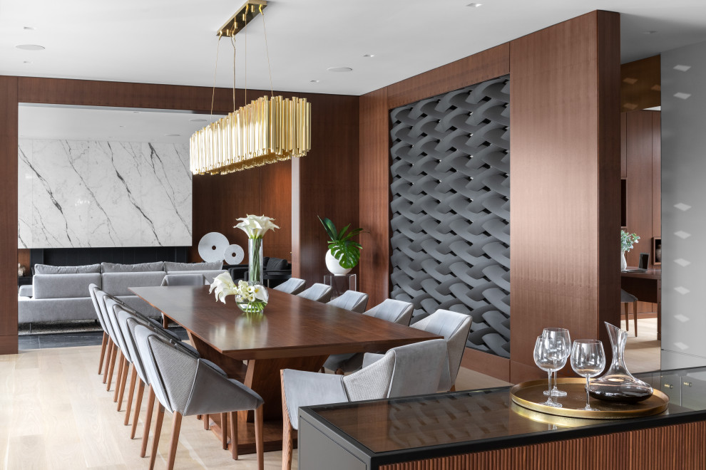 This is an example of an expansive contemporary open plan dining room in Vancouver with brown walls, light hardwood flooring, beige floors and all types of ceiling.