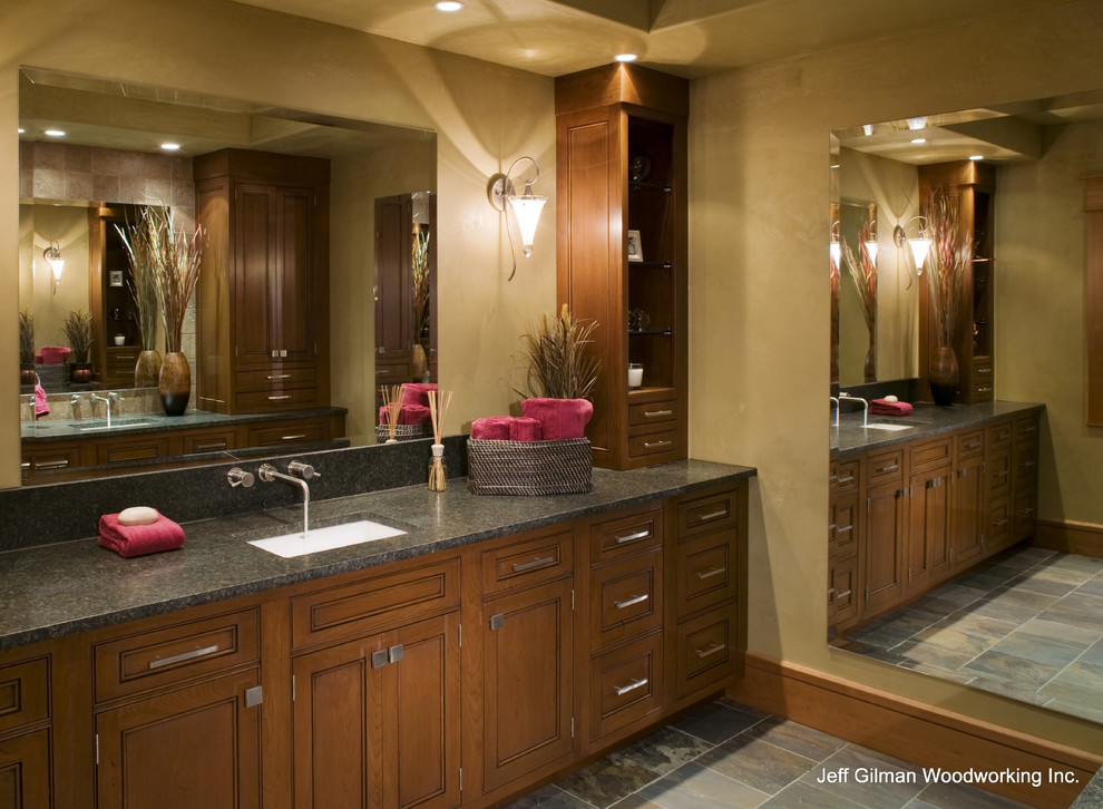 Design ideas for a large contemporary bathroom in New York with an undermount sink, recessed-panel cabinets, medium wood cabinets, granite benchtops and a corner shower.