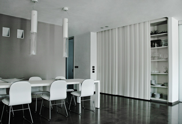 Photo of a large contemporary open plan dining room in Other with white walls, marble flooring, black floors, a drop ceiling and feature lighting.