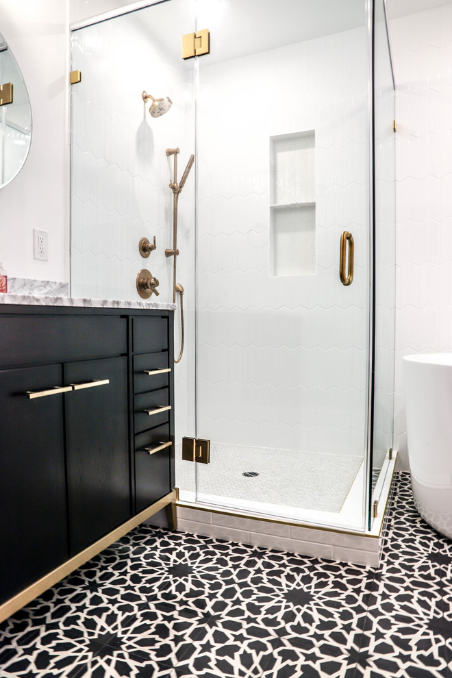 Photo of a mid-sized contemporary master bathroom in Los Angeles with flat-panel cabinets, brown cabinets, a japanese tub, a corner shower, a two-piece toilet, white tile, white walls, laminate floors, a drop-in sink, quartzite benchtops, blue floor, a hinged shower door and grey benchtops.