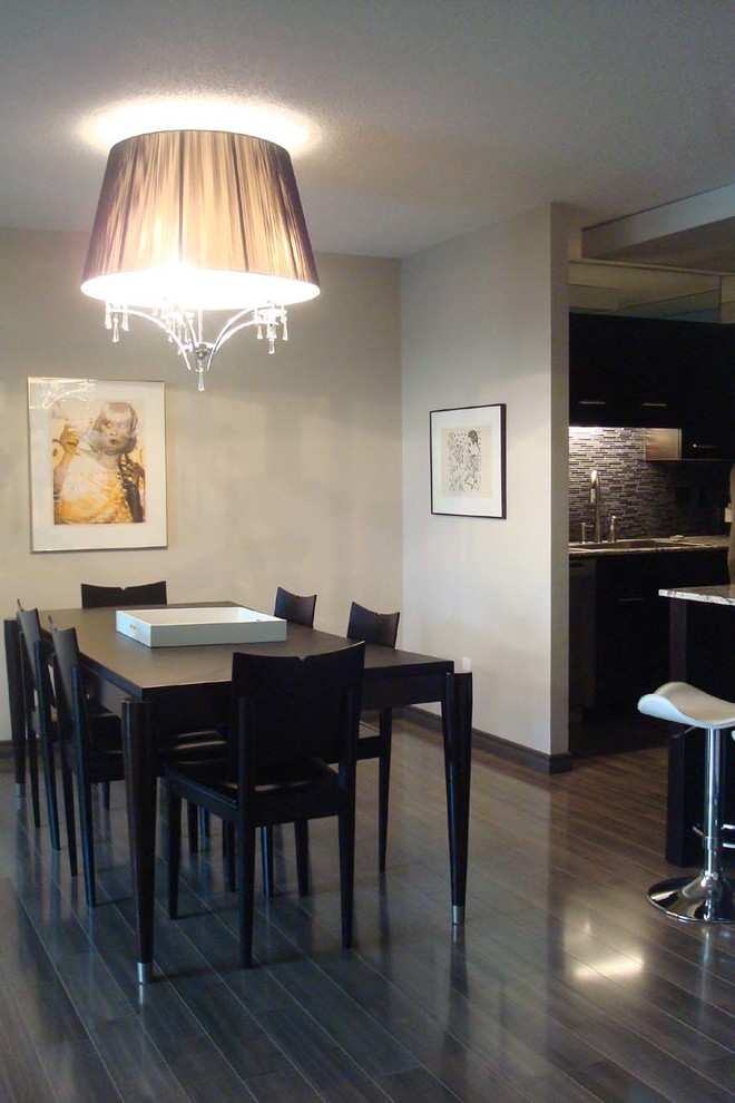 Inspiration for a small contemporary open plan dining in Other with grey walls and medium hardwood floors.