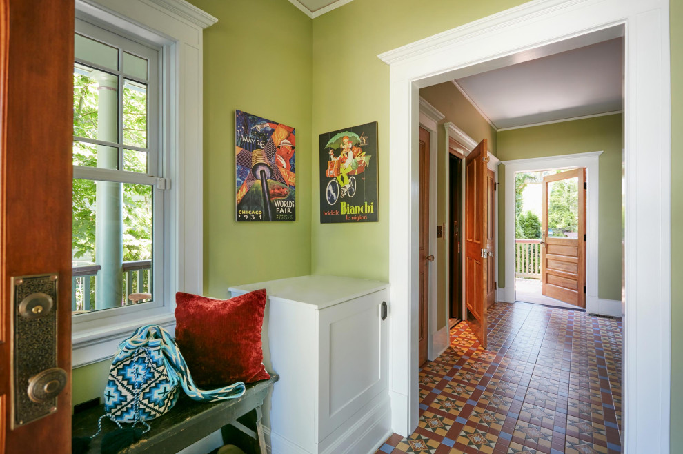 This is an example of a large victorian entrance in New York with porcelain flooring and multi-coloured floors.