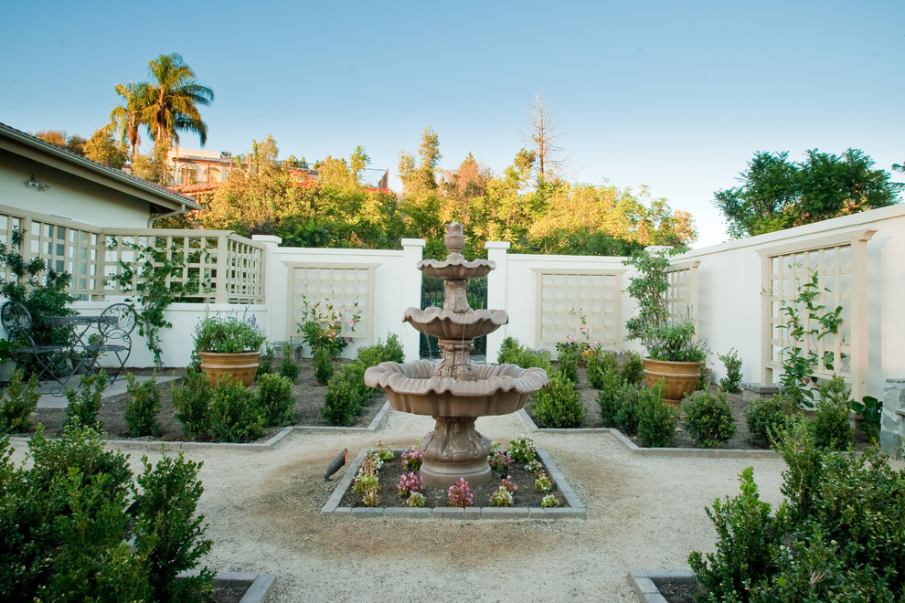 Design ideas for a mediterranean garden in San Diego with a water feature.