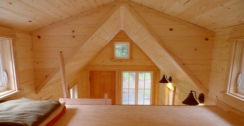 This is an example of a small traditional loft-style bedroom in Portland with no fireplace.