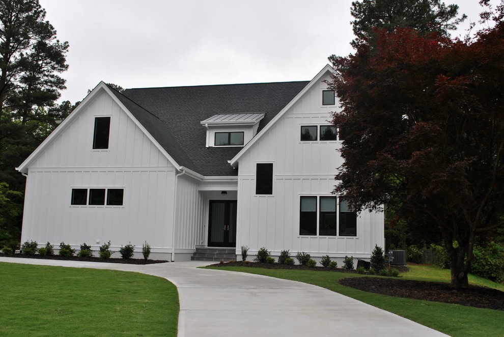 Mid-sized scandinavian two-storey white exterior in Raleigh with wood siding and a gable roof.