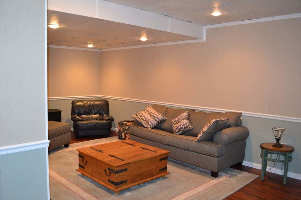 Photo of a mid-sized contemporary look-out basement in New York with grey walls, light hardwood floors and no fireplace.