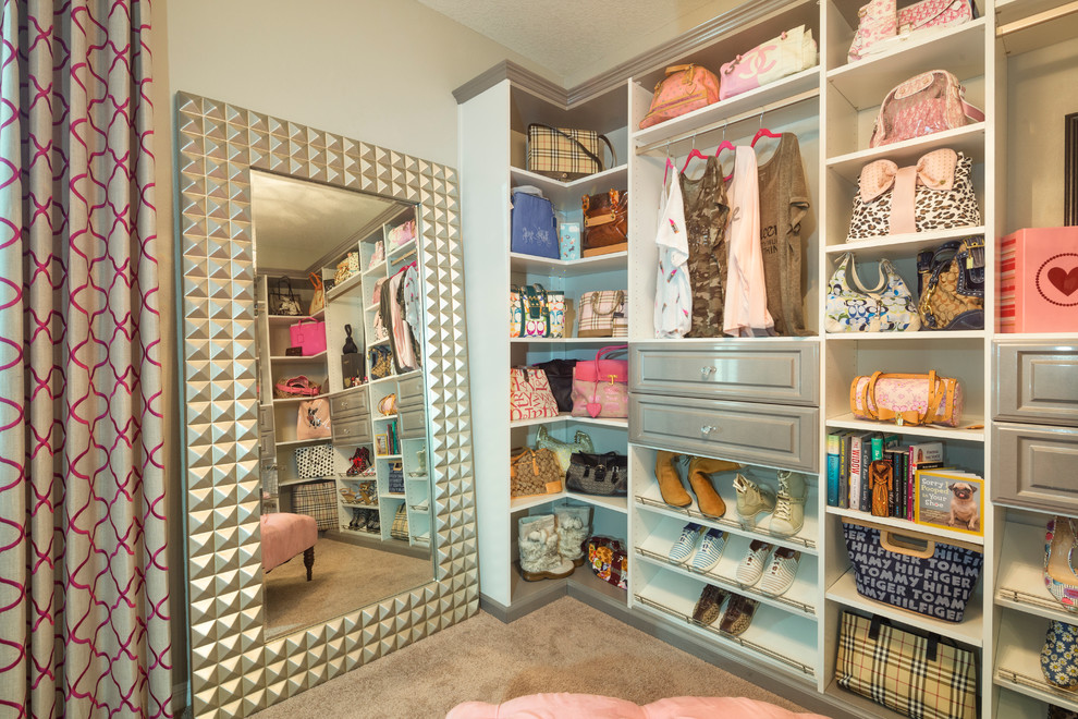 Inspiration for a large transitional women's dressing room in Tampa with grey cabinets and raised-panel cabinets.