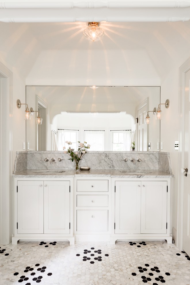 Elegant mosaic tile floor bathroom photo in Portland with an undermount sink, shaker cabinets, white cabinets and white walls