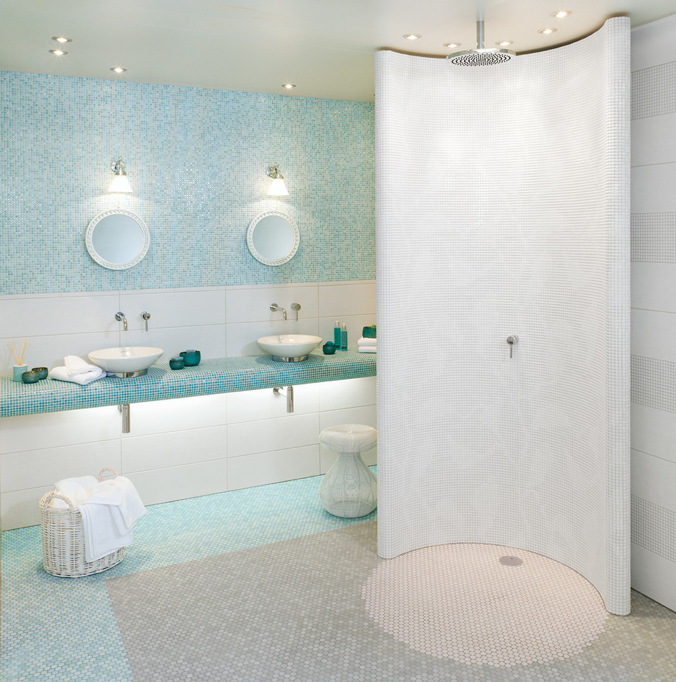 Inspiration for a large master bathroom in Aalborg with a curbless shower, blue tile, mosaic tile, multi-coloured walls, mosaic tile floors, a vessel sink, tile benchtops and an open shower.