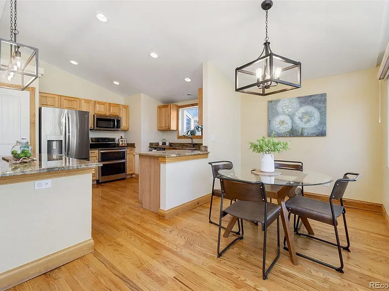 Transitional dining room photo in Denver